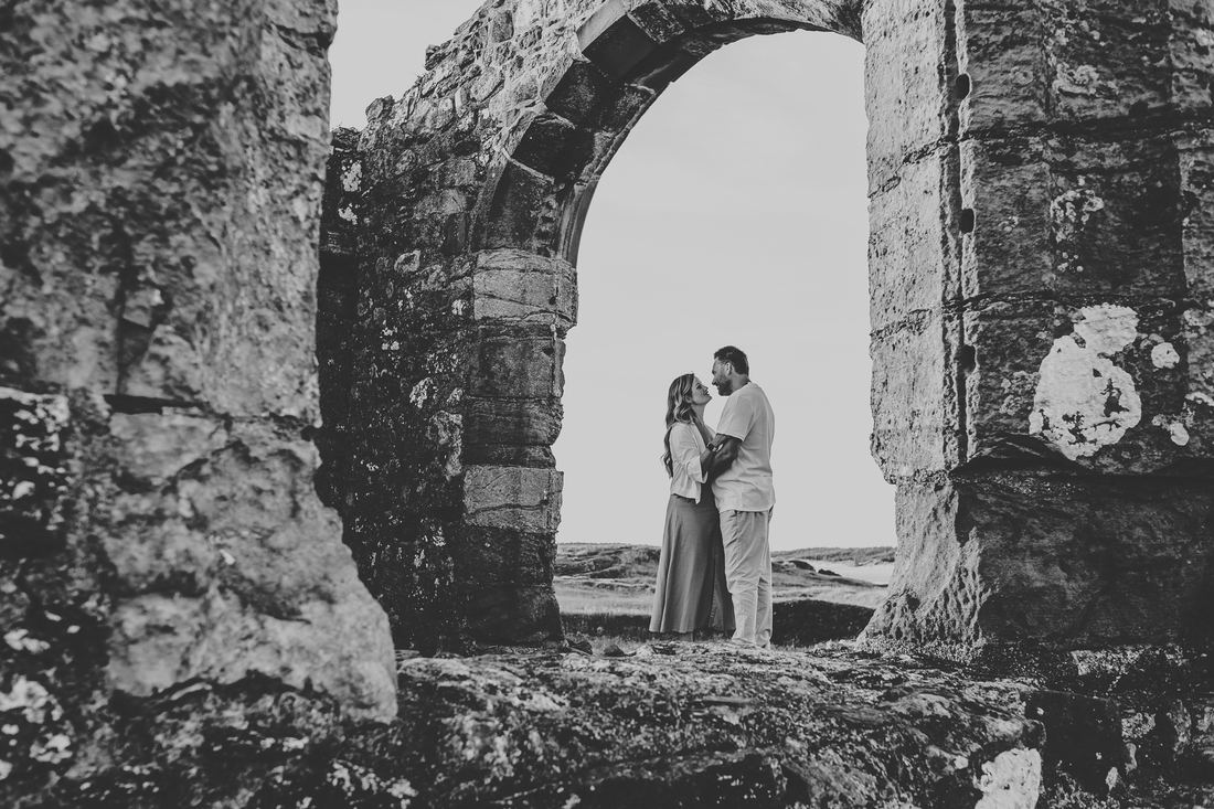 Couple walking the coastal path, Llanddwyn Island, Anglesey