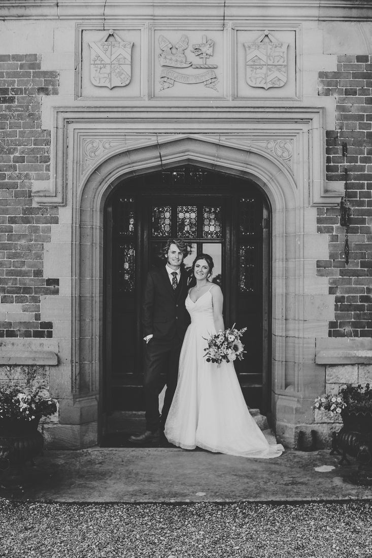 Newlywed portraits with the wedding car, Wigfair Hall wedding photography, North Wales