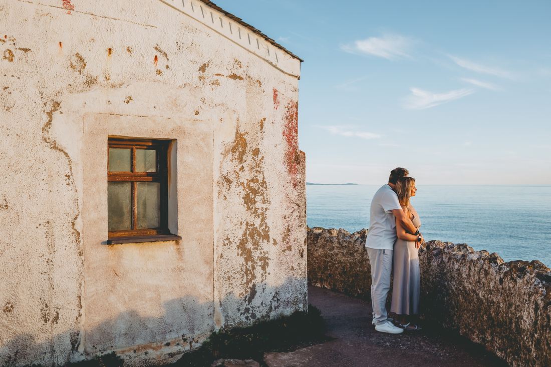 Couple walking the coastal path, Llanddwyn Island, Anglesey